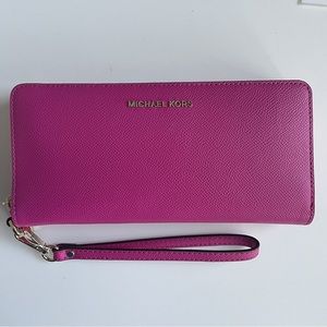Brand new Michael Kors wild Berry leather continental wristlet